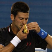 Novak Djokovic eats a banana during Australian Open 2012; Getty Images