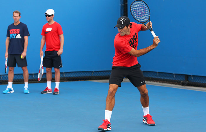 Roger Federer practices while Stefan Edberg (left) and Severin Luthi watch from the sidelines, Australian Open, Melbourne, 2014. GETTY IMAGES Roger Federer practices while Stefan Edberg (left) and Severin Luthi watch from the sidelines, Australian Open, Melbourne, 2014. GETTY IMAGES