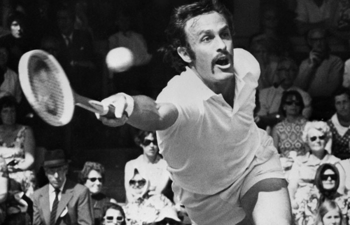 John Newcombe in action at Wimbledon; Getty Images