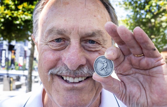 John Newcombe is celebrated on the AO 2025 match coin.