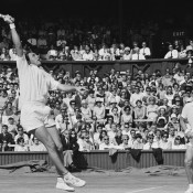 Ken Fletcher (left) flies for a smash while John Newcombe looks on. HULTON ARCHIVE