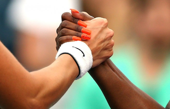 Sloane Stephens (R) shakes hands with Mandy Minella after winning their 2013 US Open first round match; Getty Images